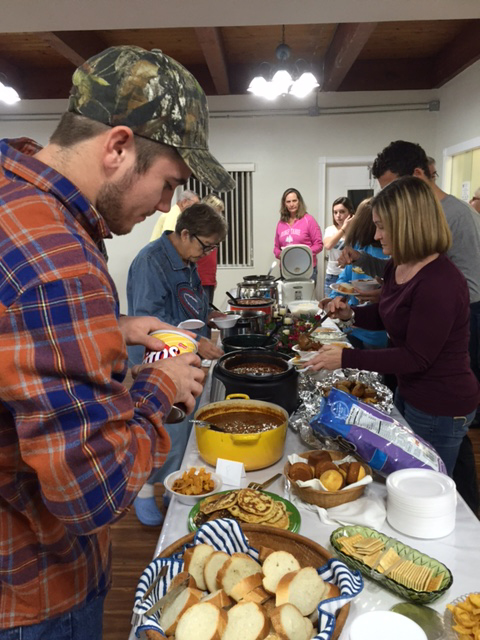 Adding chili toppings