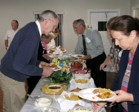 Digging in at the fellowship meal.