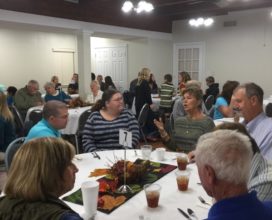 Seated and ready to eat Thanksgiving Meal