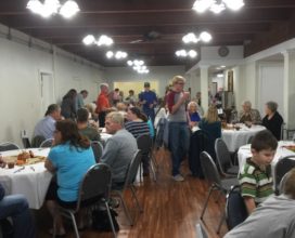 find a seat at the fellowship meal
