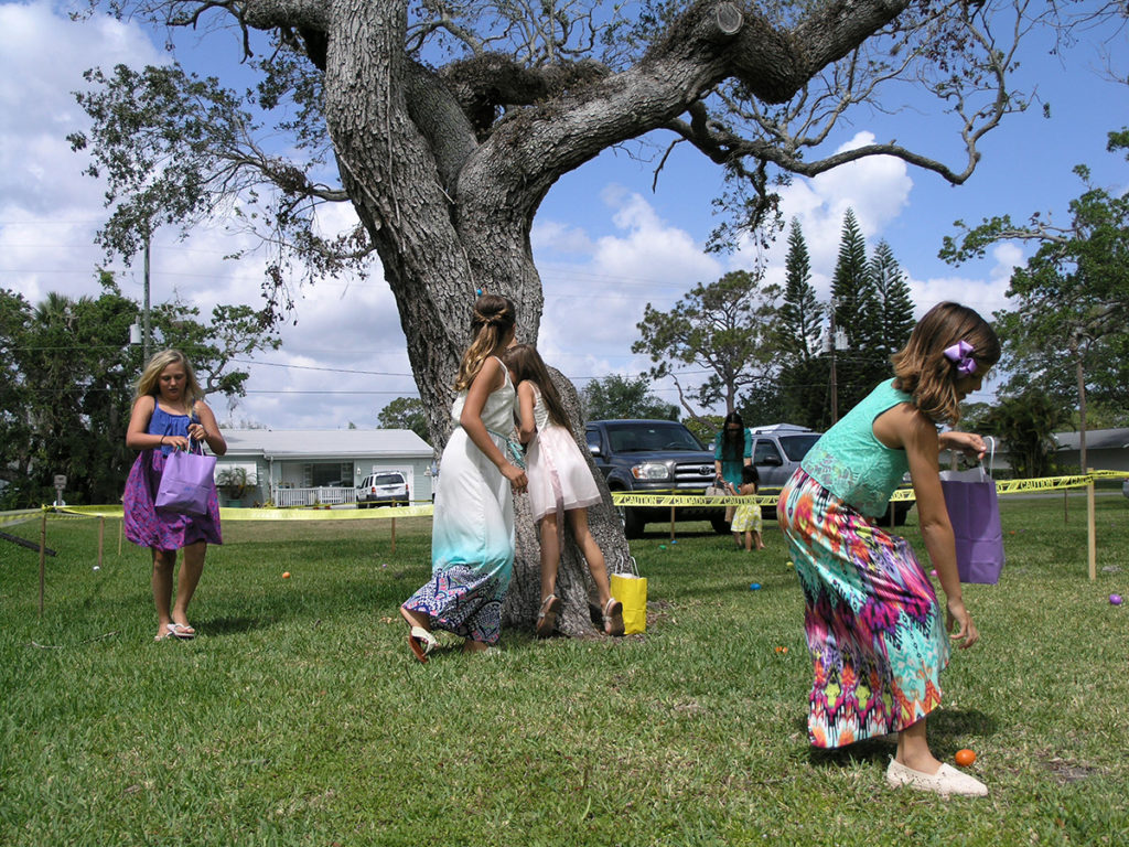 Girls hunt for resurrection eggs at Beachside Baptist Church