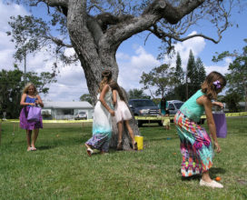 Girls hunt for resurrection eggs at Beachside Baptist Church