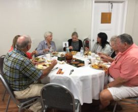 Eating together at Thanksgiving church meal